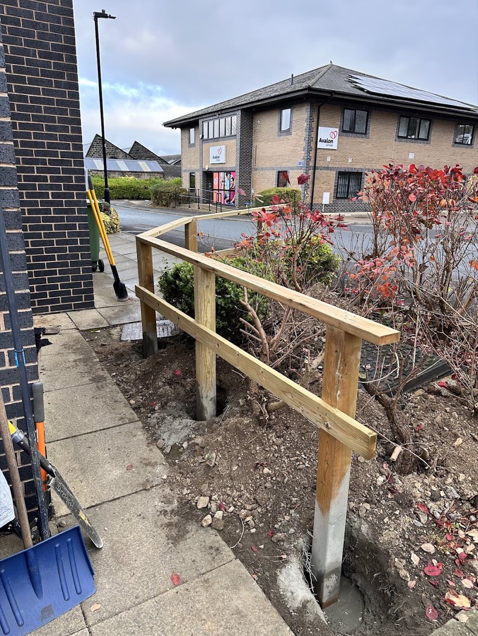 Timber handrail posts set in concrete before finishing.