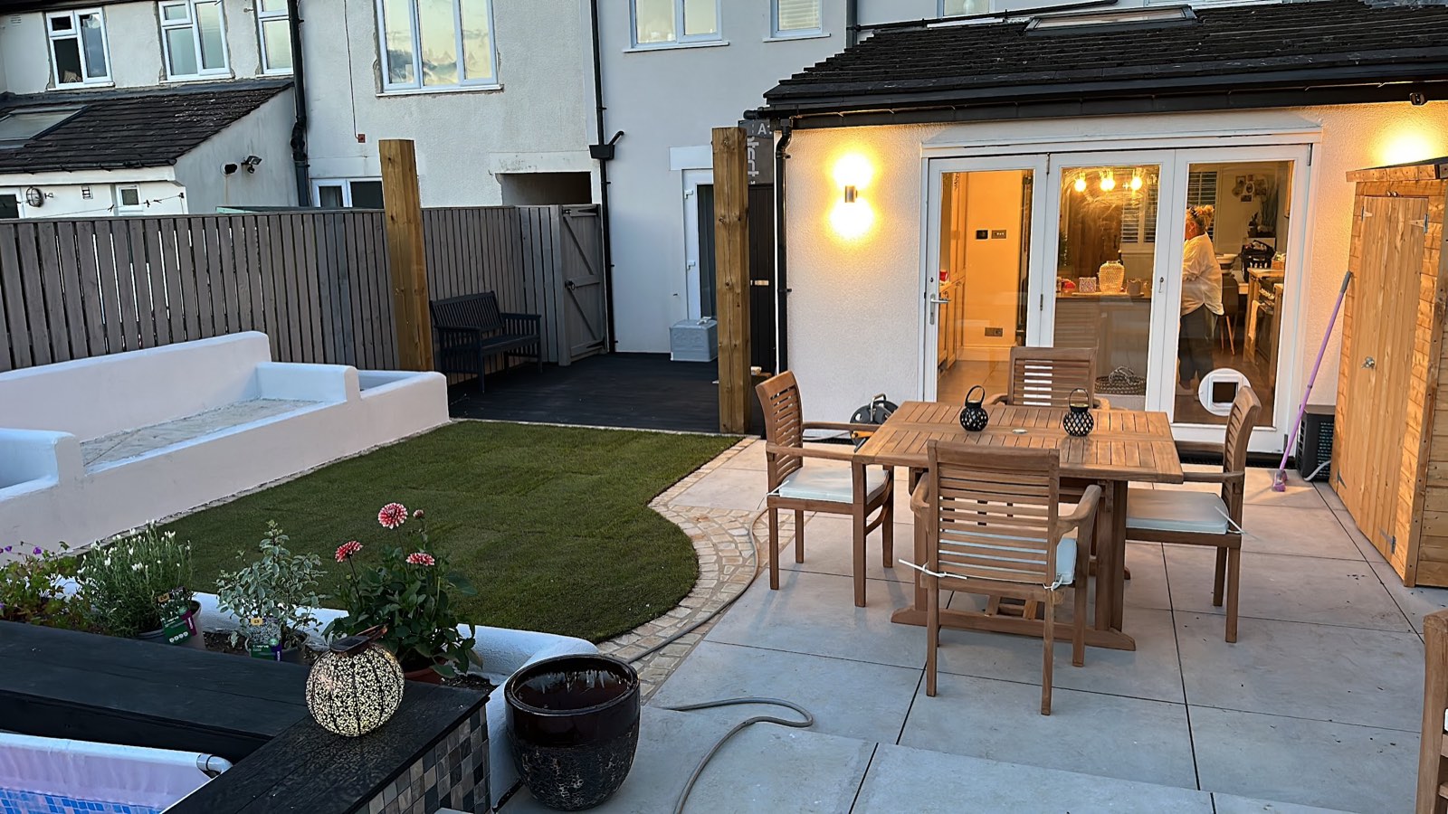 Rear garden at dusk before the pergola was built.